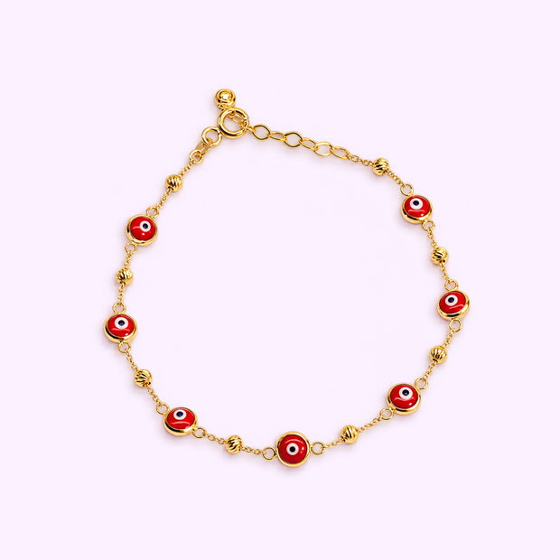 Pulso ojo protector rojo con bolitas Oro turco 10K